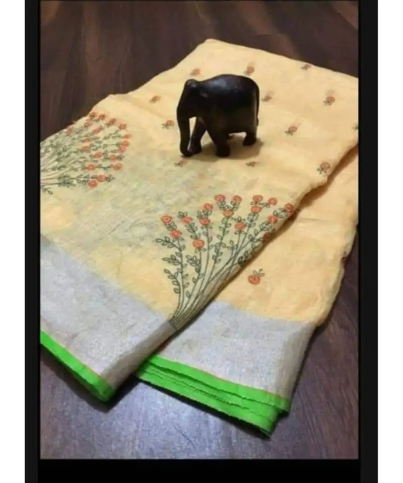 Cream handcrafted linen saree with embroidery work on the saree
