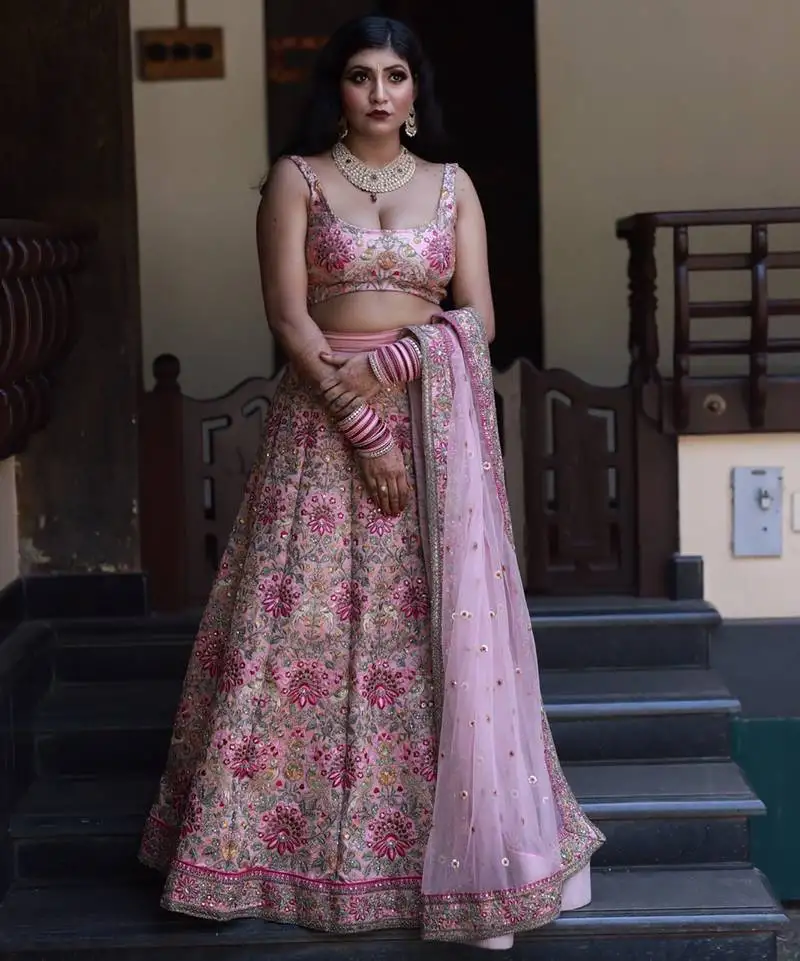 Peach colored wedding bridal designer heavy lehenga choli with dupatta