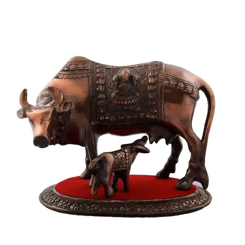 Kamdhenu cow and calf metal figurine
