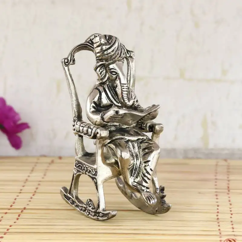 Lord ganesha on rocking chair antique showpiece