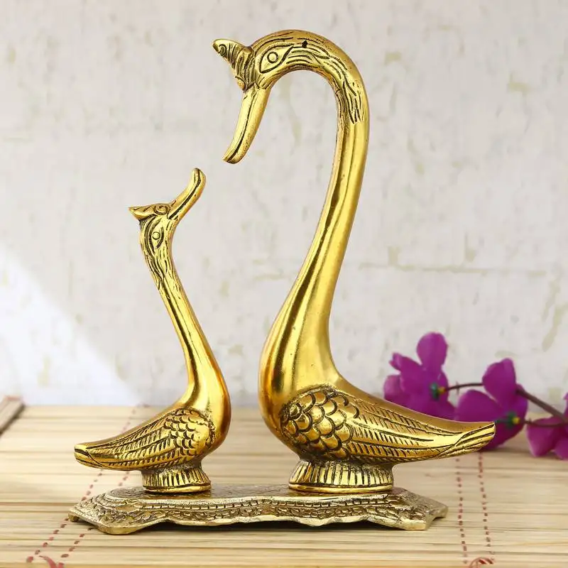 Loving golden swan couple figurine
