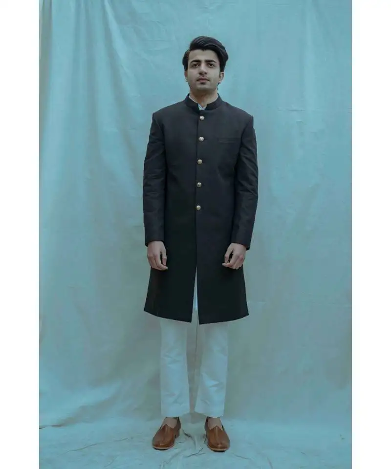Black color achkan with white kurta and white pants