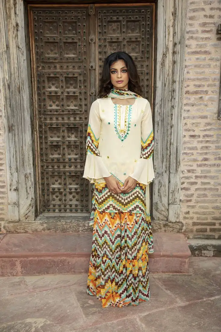 Cream printed kurta with printed sharara and dupatta