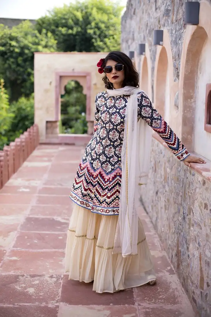 Cream printed front open jacket with sharara and dupatta