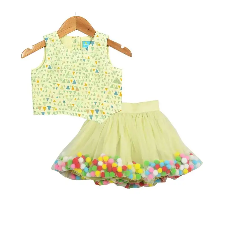 Hue of green pompom skirt with asymmetric crop top