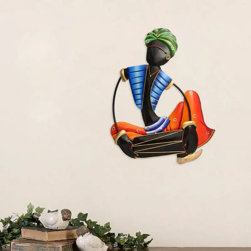 Musician tribal man playing dholak wall hanging