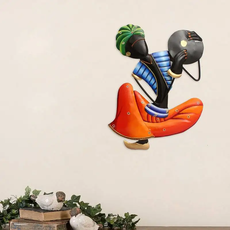 Musician tribal man playing tapli wall hanging