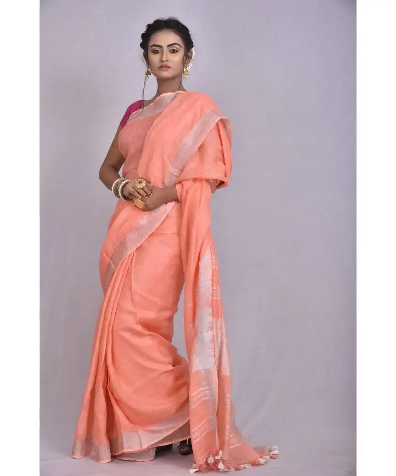 Light orange linen saree with blouse with zari border