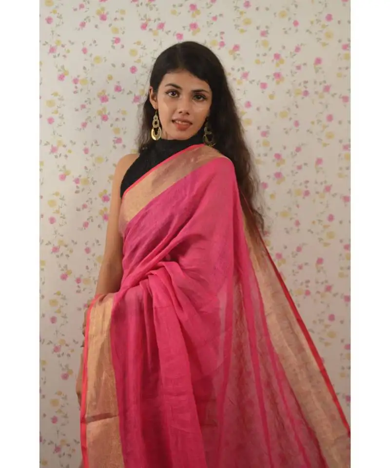 Pink linen saree with blouse with zari border