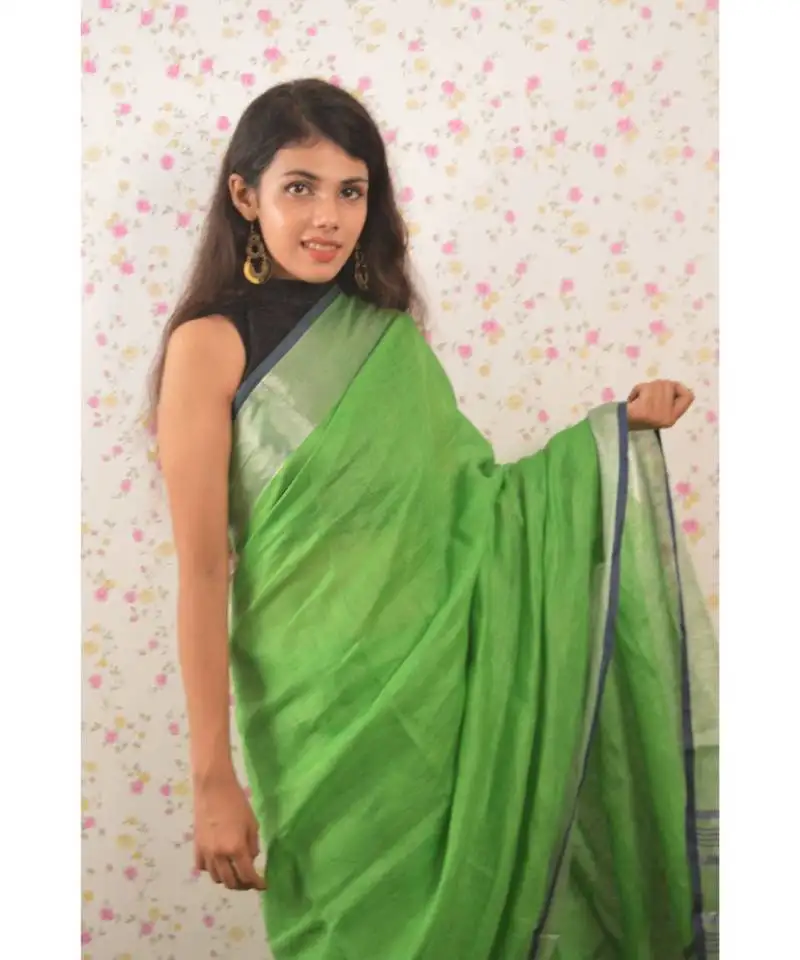 Green linen saree with blouse with zari border