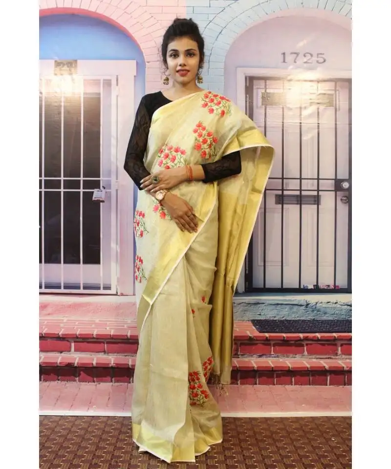 Light creamish golden tissue linen embroidered saree with blouse