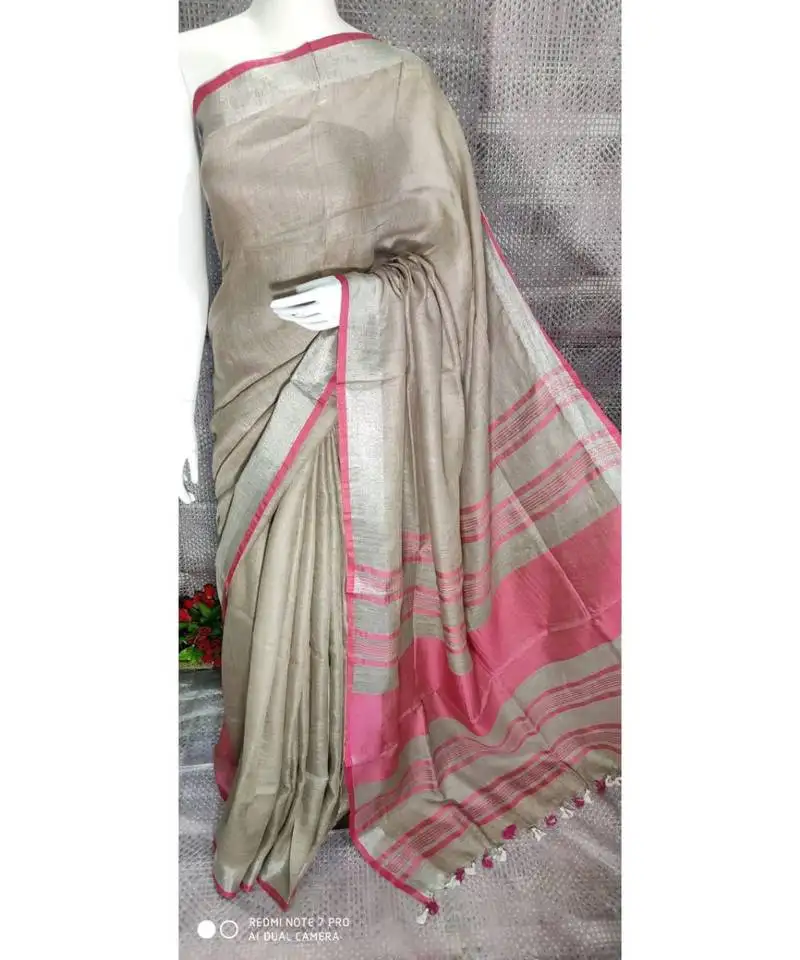 Grey shade linen saree with blouse with zari border