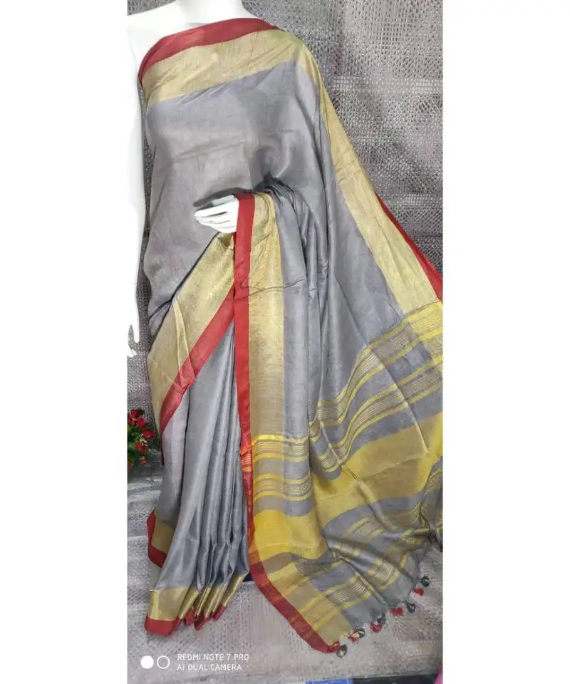 Grey shade linen saree with blouse with broad zari border
