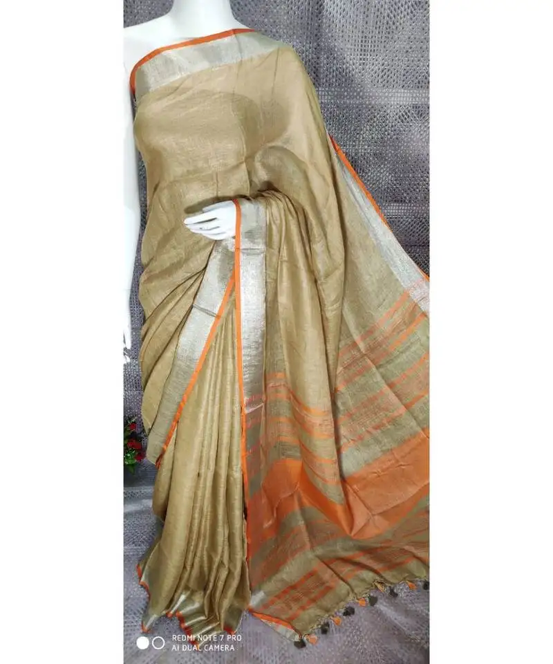 Beige shade linen saree with blouse with zari border