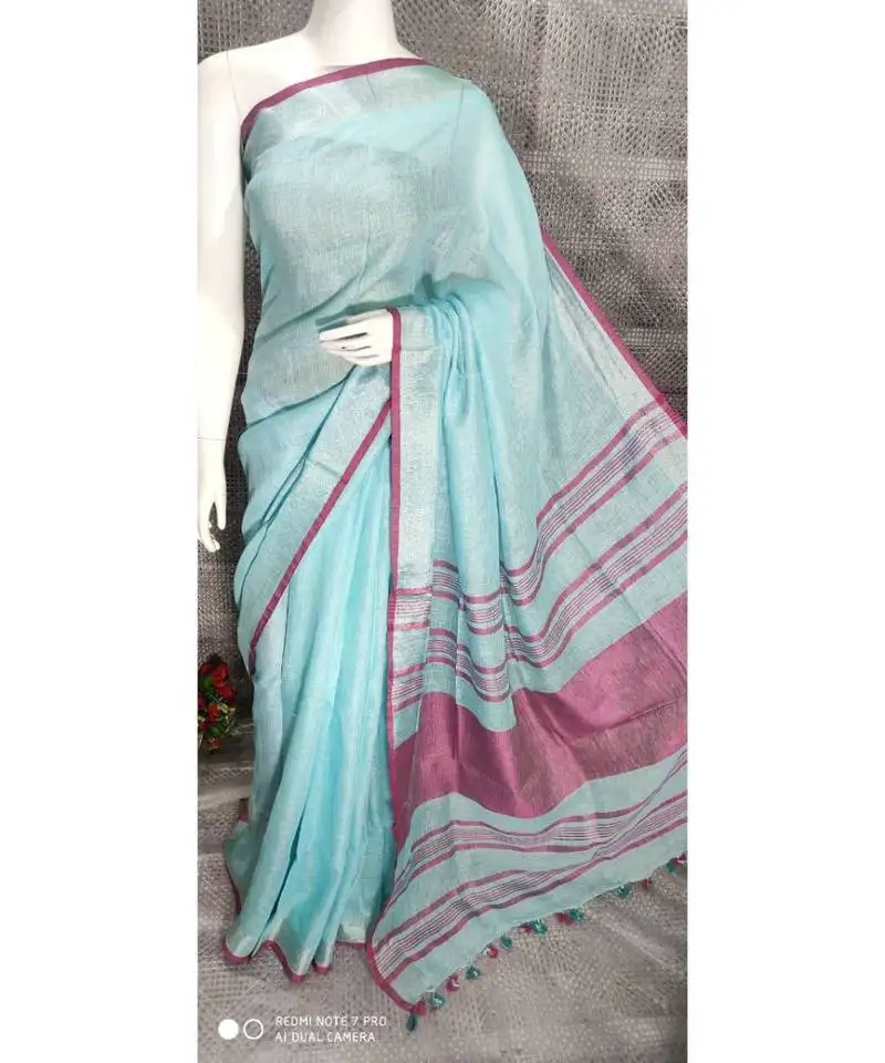 Blue shade linen saree with blouse with zari border