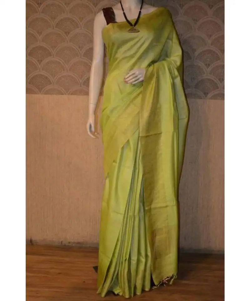 Lemon shade tussar moonga silk saree with blouse with zari border