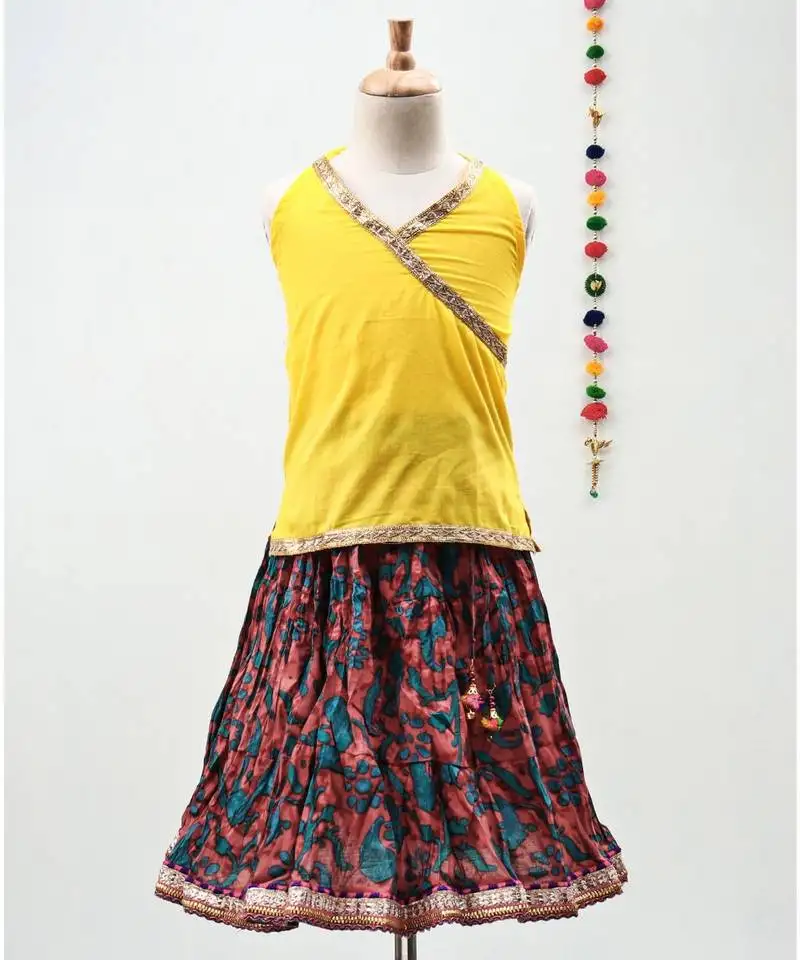 Multicolor cotton printed lehenga with a contrast halter neck choli and a lovely golden lace