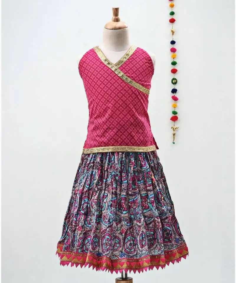 Pink and blue cotton lehenga with a contrast self print halter neck choli and a golden lace