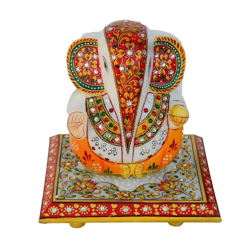 Lord ganesha on floral designed marble chowki