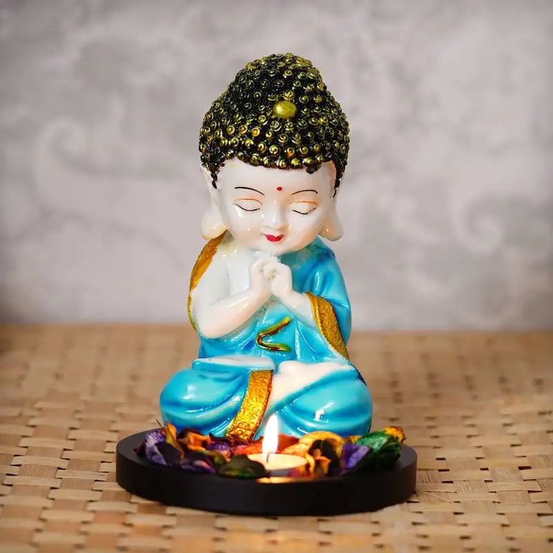 Ecraftindia praying blue monk buddha with wooden base, fragranced petals and tealight