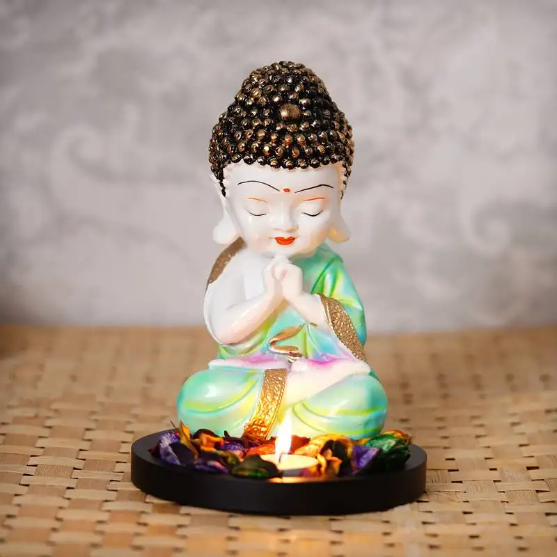 Ecraftindia praying green monk buddha with wooden base, fragranced petals and tealight