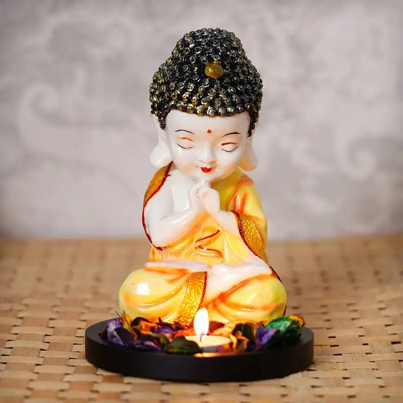 Ecraftindia praying orange monk buddha with wooden base, fragranced petals and tealight