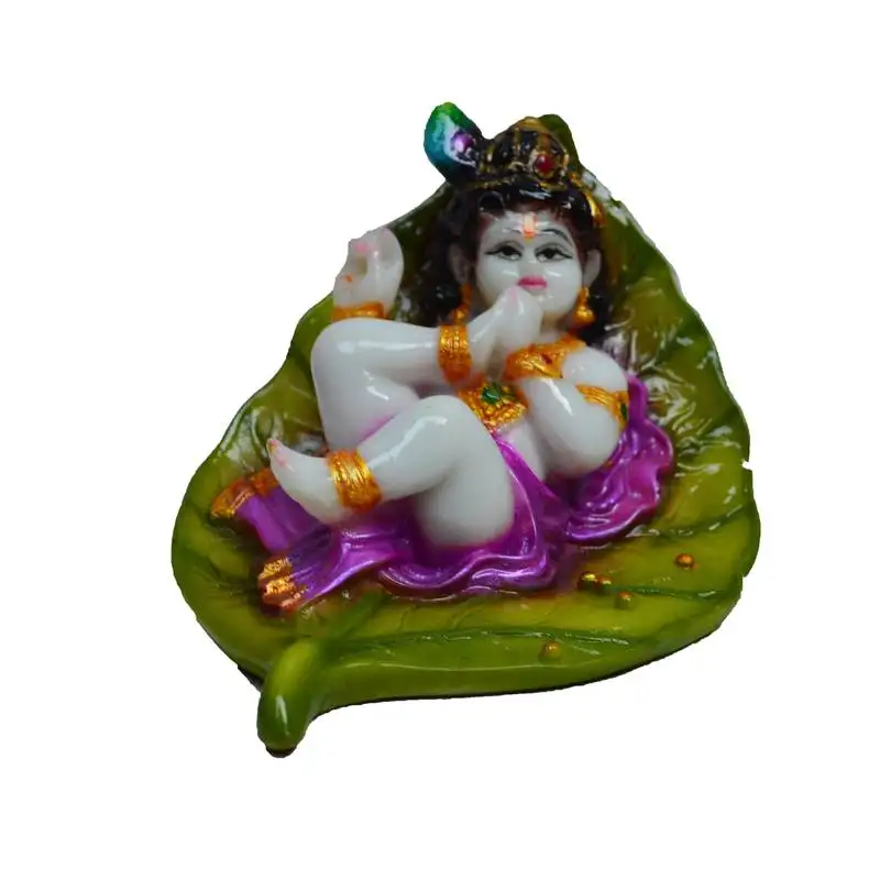 Synthetic laddu gopal on green leaf