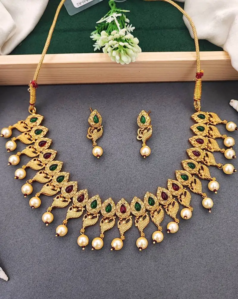 Matte gold peacock necklace set with ruby & green stones, pearl drops – ethnic bridal jewellery