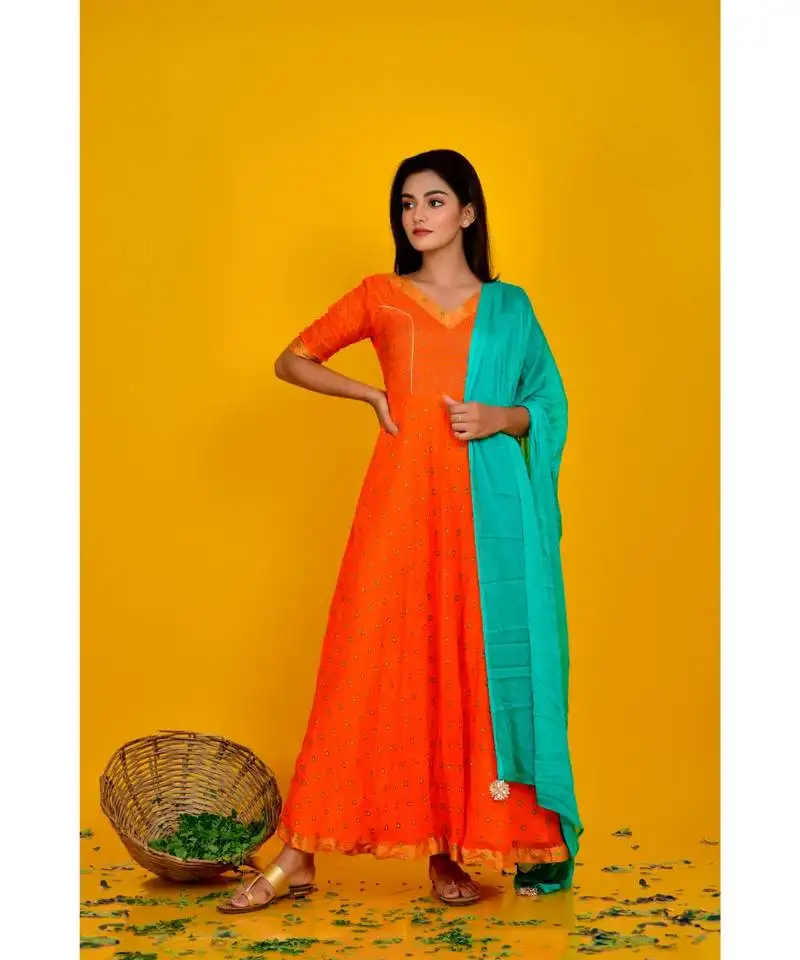 Orange bandhani dress with green dupatta