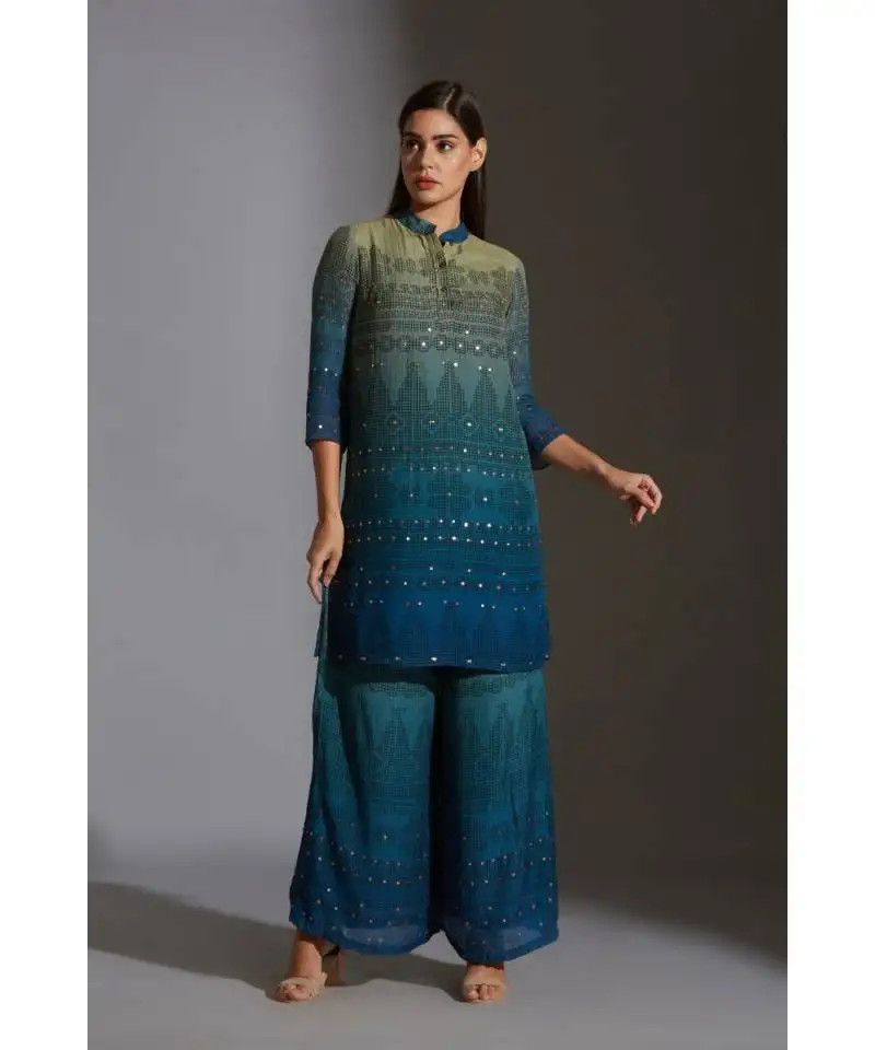 Printed kurta with side slits and printed pants with mirror work embroidery