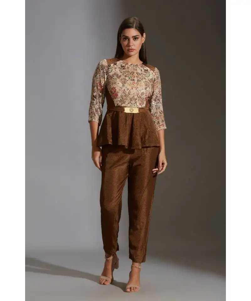 Pepmlum top with belt paired with printed pants