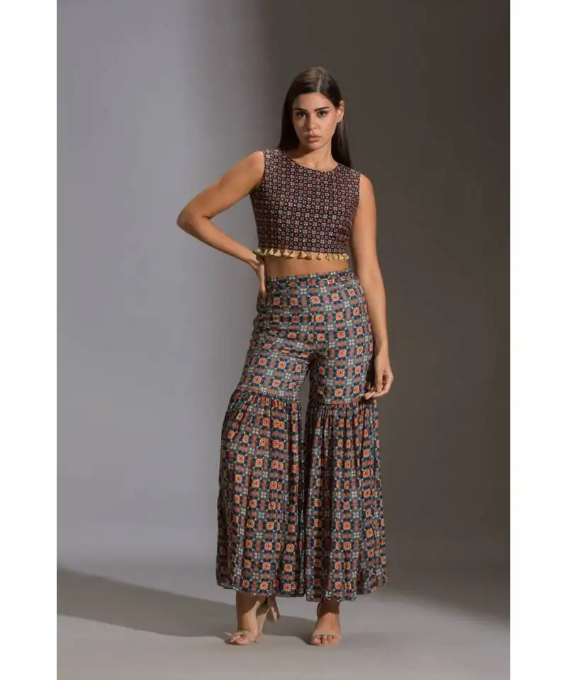 Printed crop top with tassel detail paird with printed sharara and jacket