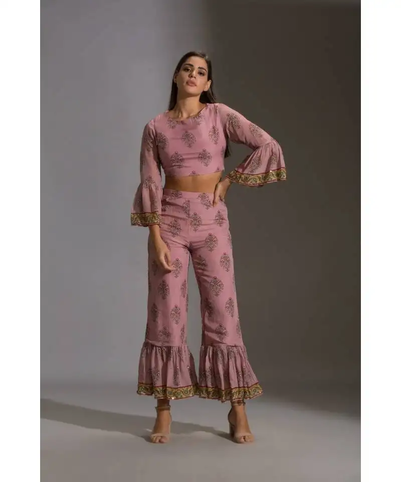 Crop top of with flared sleeves paired with elastic bottom and crop jacket