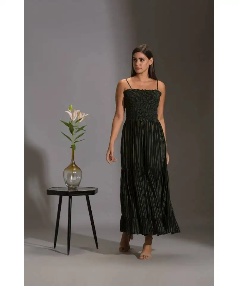 Printed rushed jumpsuit with belt and paired with sequence cape