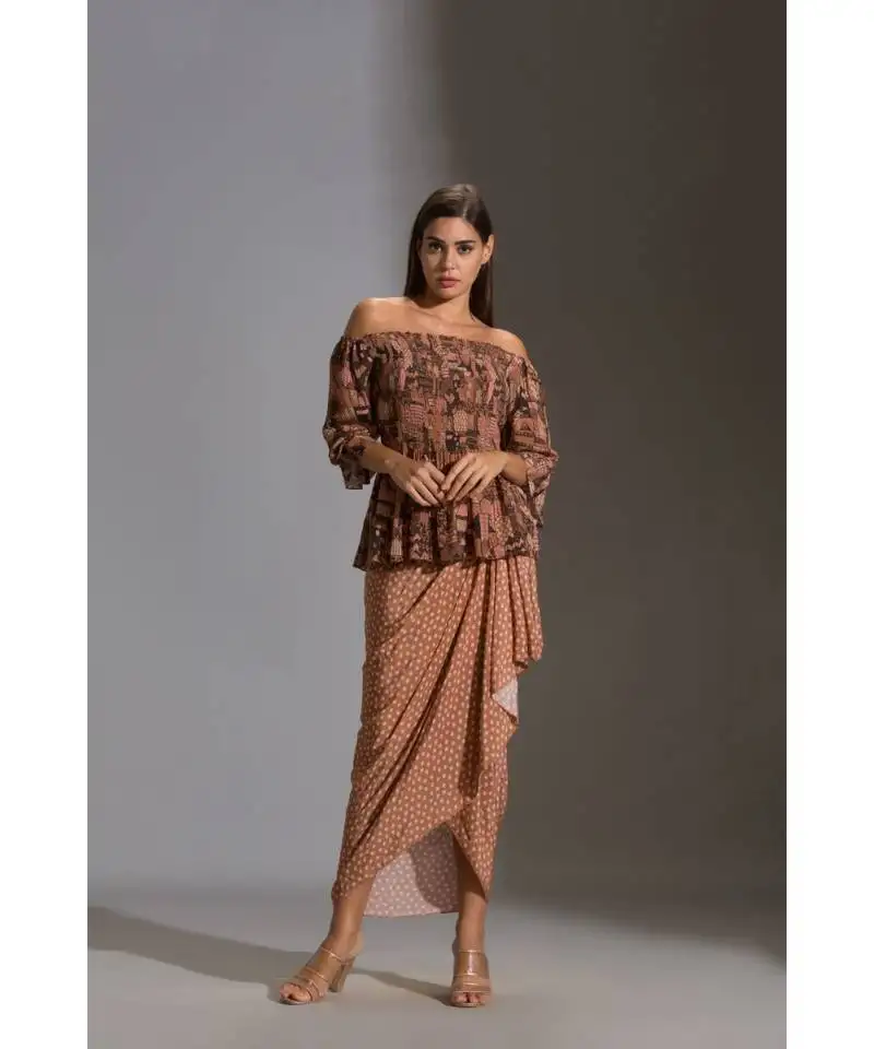 Rushed offshoulder top paired with printed dhoti skirt