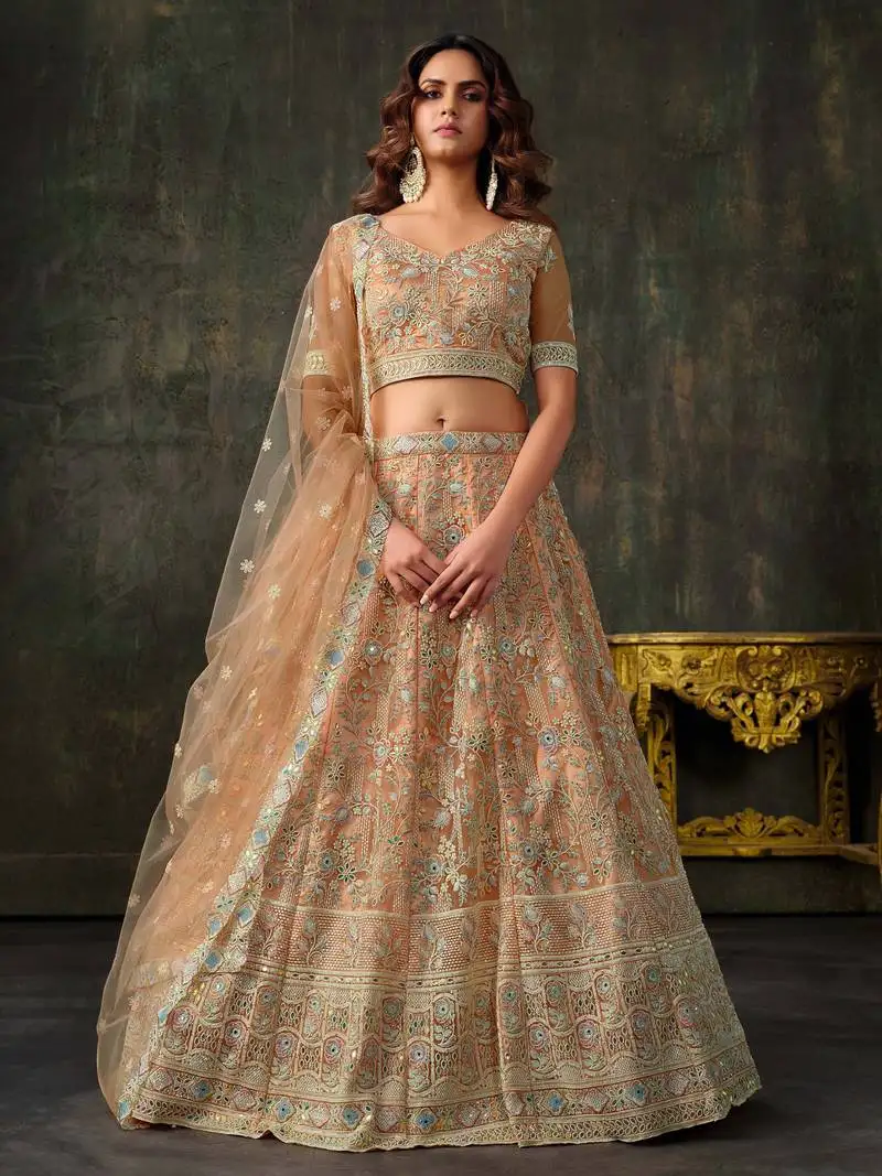 Peach net silk wedding lehenga with heavy handwork & blouse