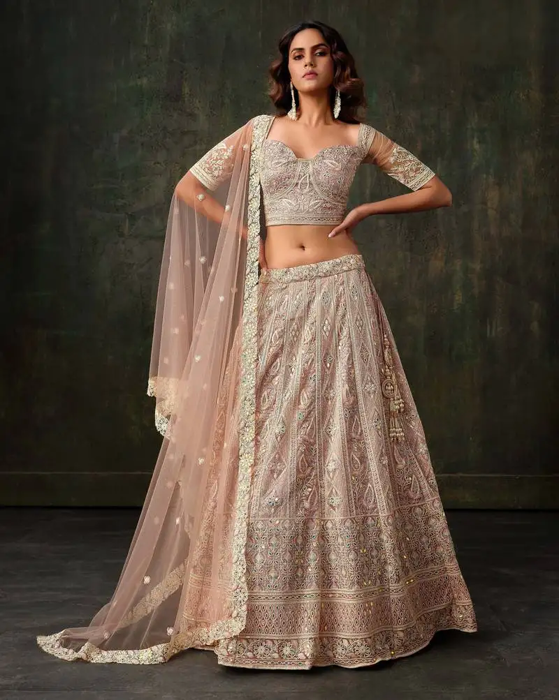 Baby pink net silk bridal lehenga with heavy embroidery & blouse