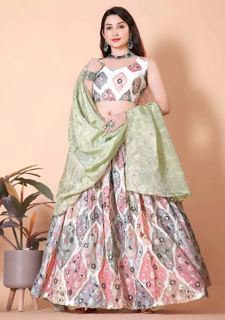 Classic white pista lehenga choli with a touch of grace