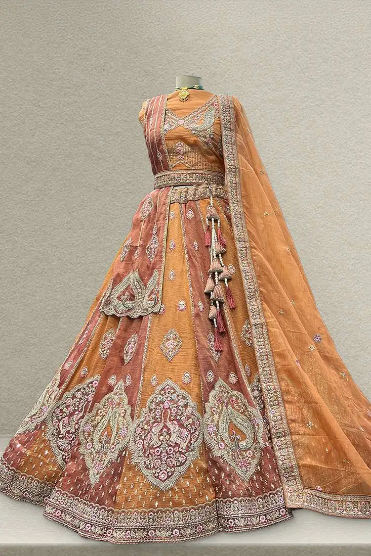 Rust color zari resham tissue work lehenga with unstitched blouse