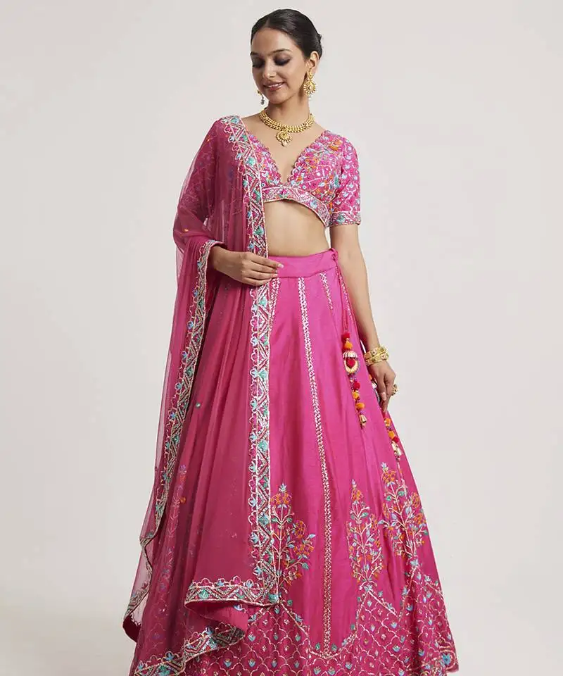 Magenta pink embroidered net lehenga
