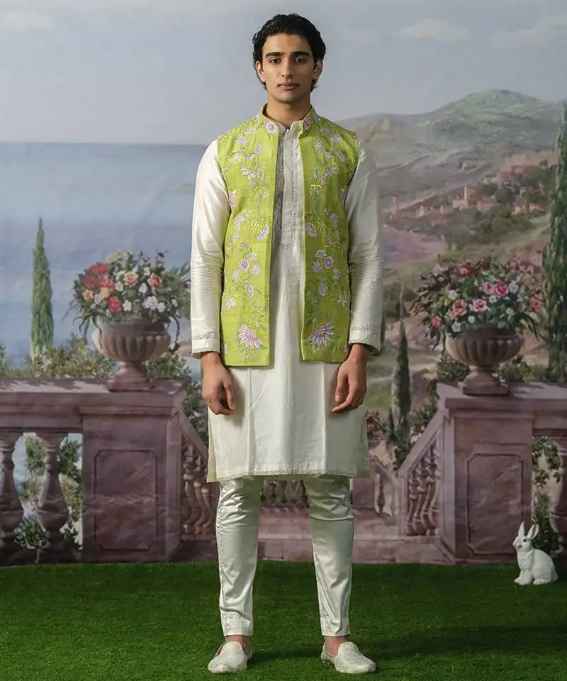 Green embroidered chanderi silk nehru jacket paired with kurta pajama