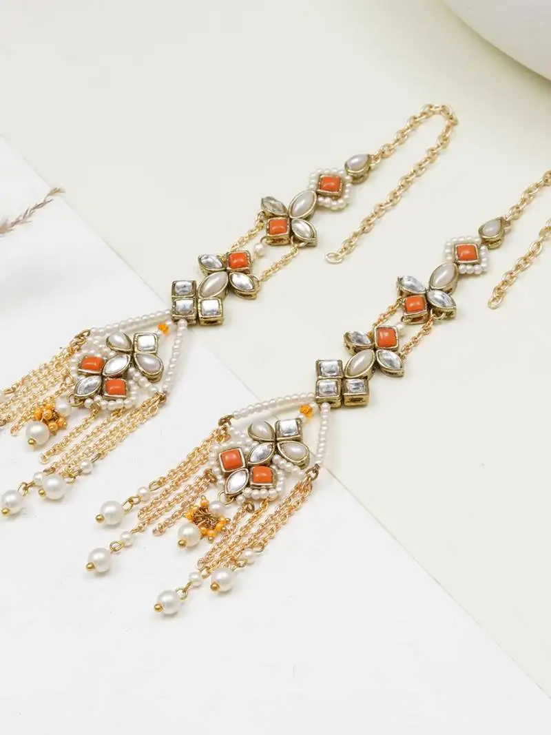 Orange kundan dangler earrings with ear chain