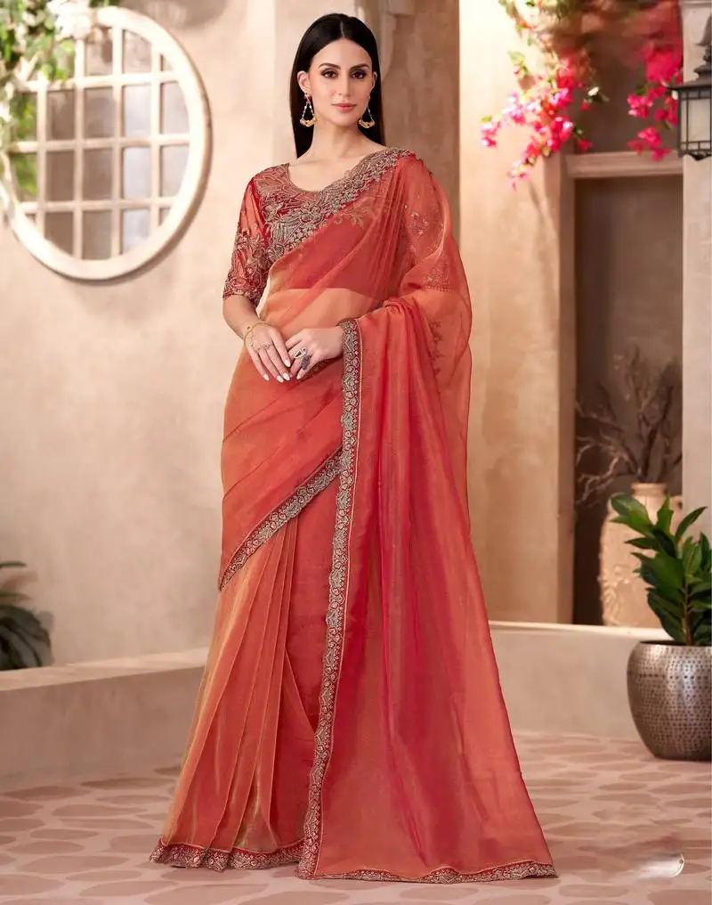 Rust golden sparkle tissue saree with linen work blouse