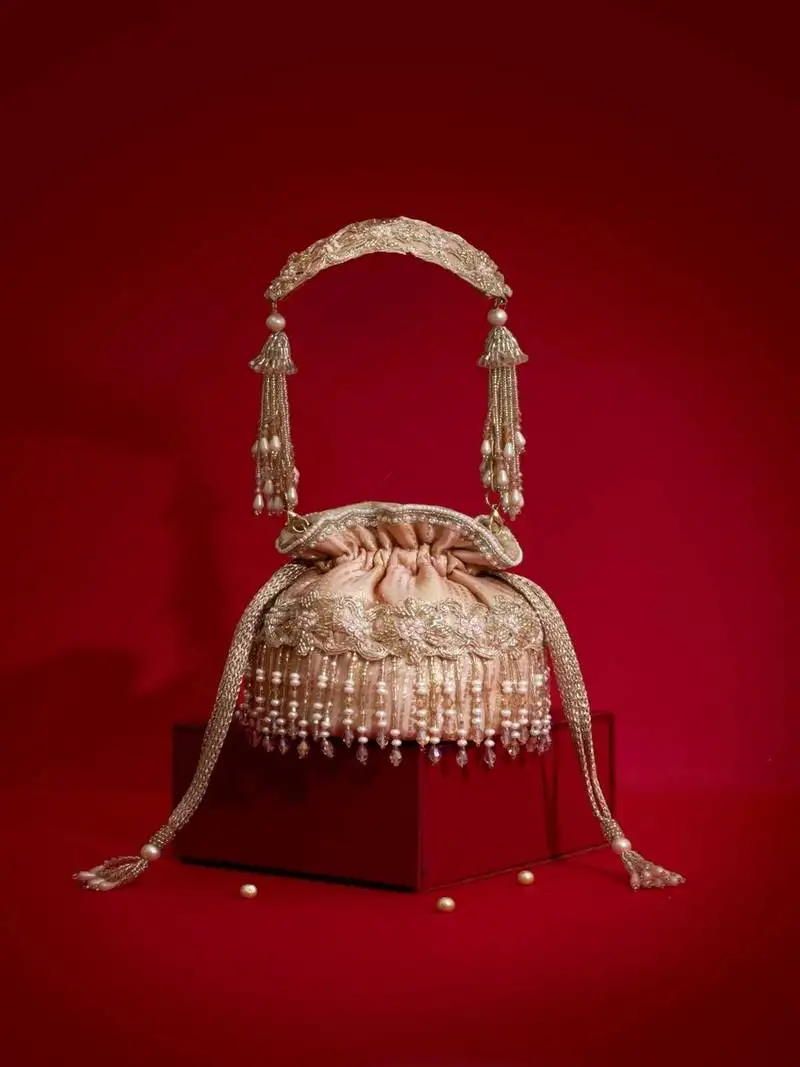 Pink embroidered silk potli bag