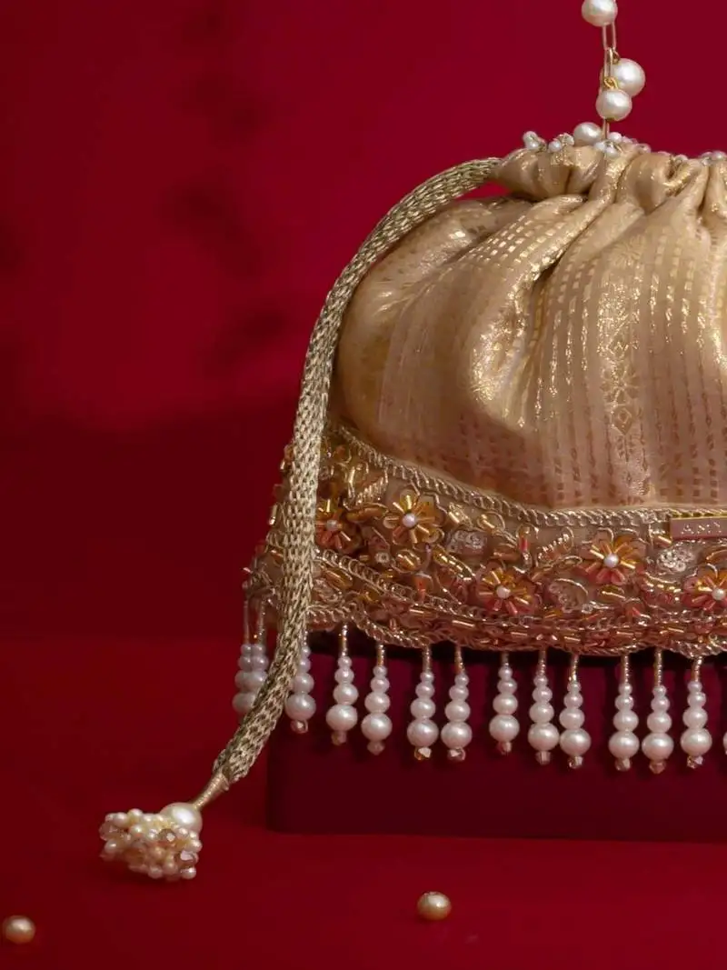 Beige embroidered silk potli bag