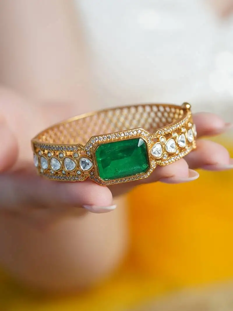 Gold plated kundan green stone bangle