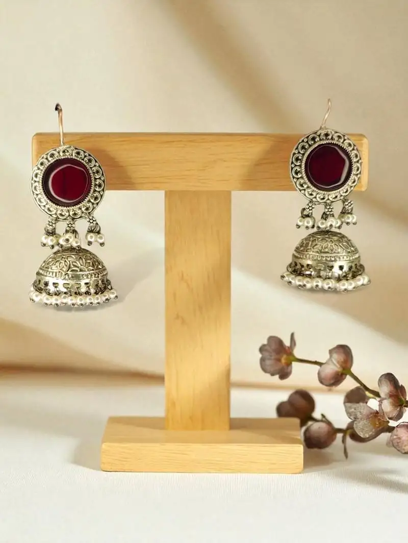 Golden glamour antique jhumka earrings with green stone & pearl detailing