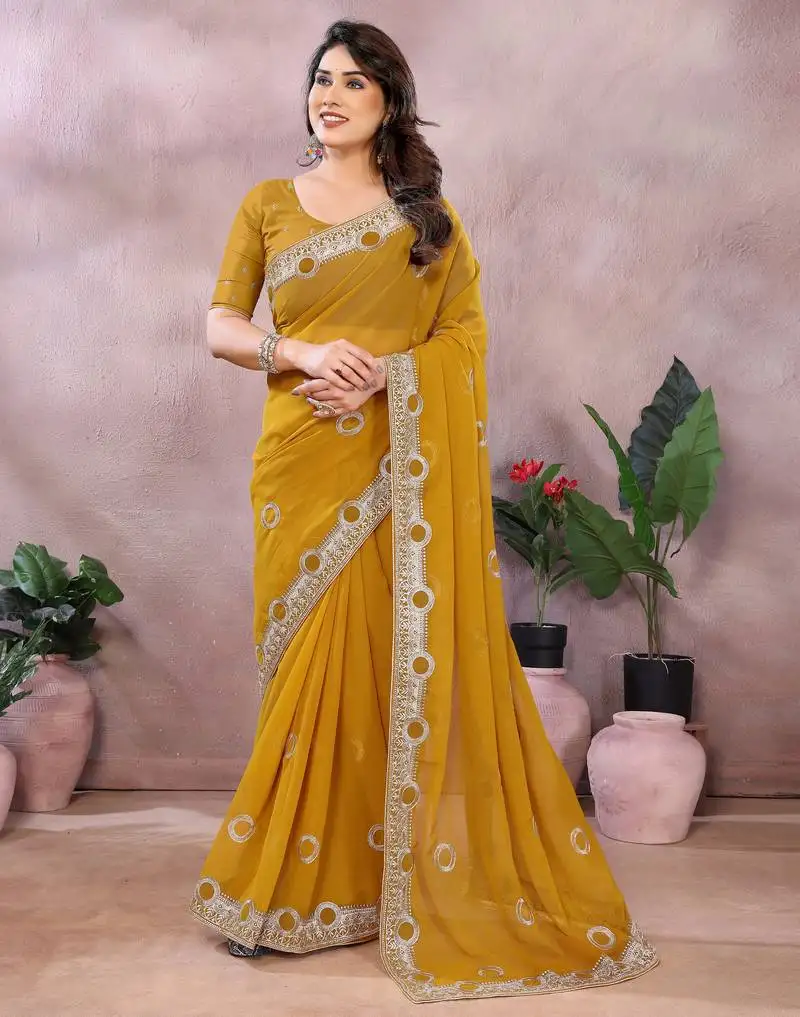 Dark yellow embroidered georgette saree