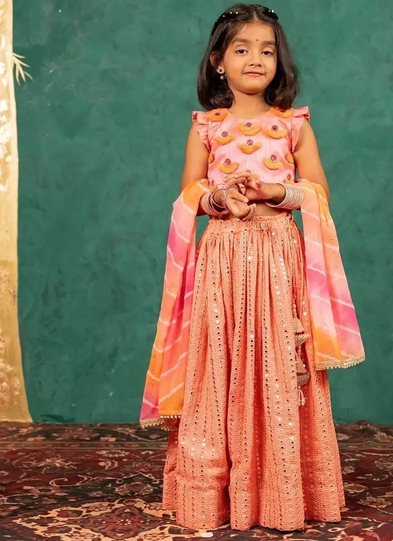 Girls pink salmon coloured mirror handworked top and mirror embroidered georgette lehenga with dupatta