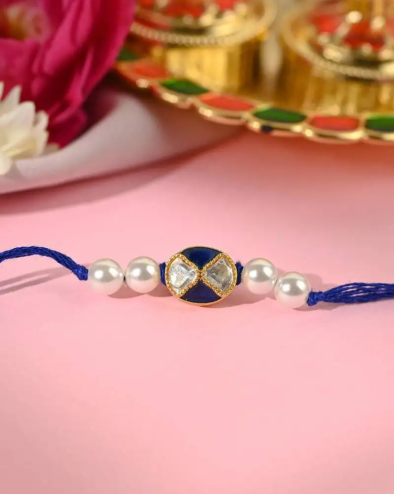 Navy blue thread rakhi with dual stone charm and pearl beads